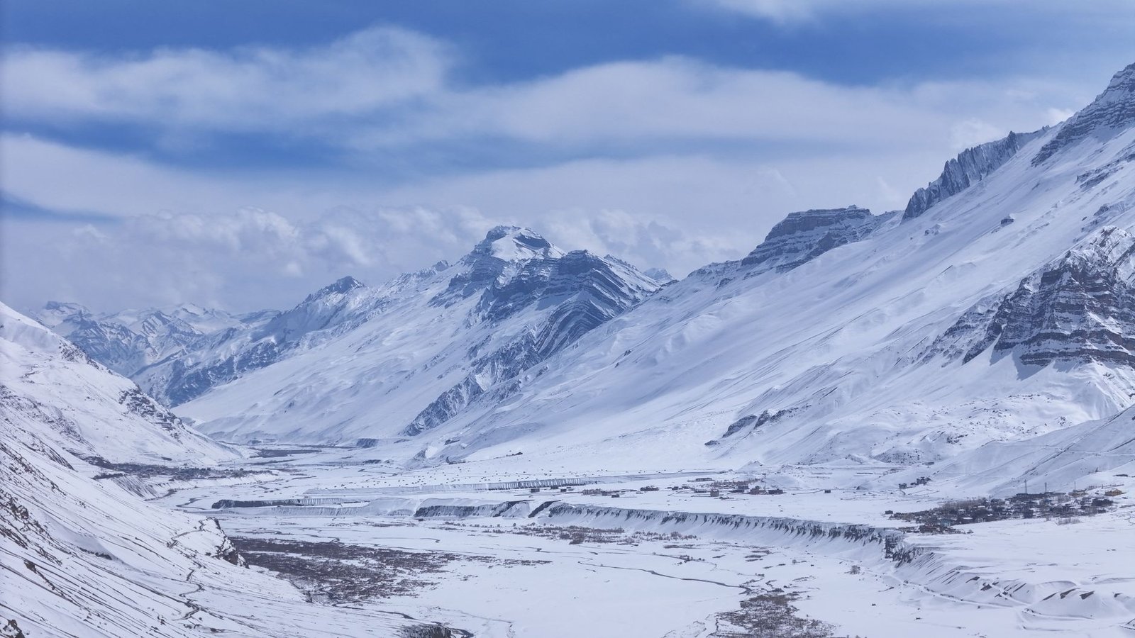 Breathtaking view of the snow-covered peaks and valleys of the Himalayan mountains in winter.