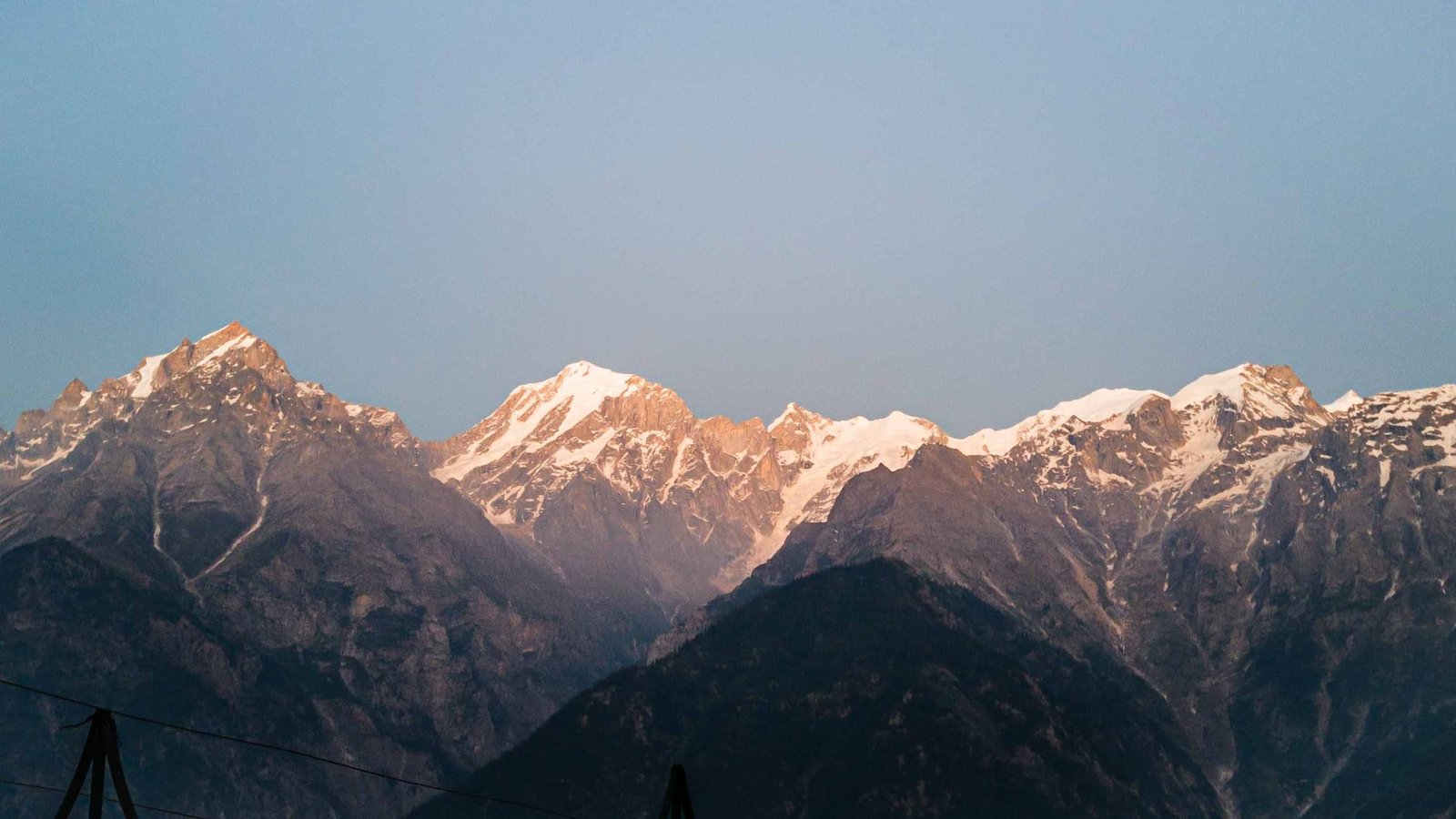 Experience the majestic snowcapped Himalayas at sunset in Kalpa, Himachal Pradesh.