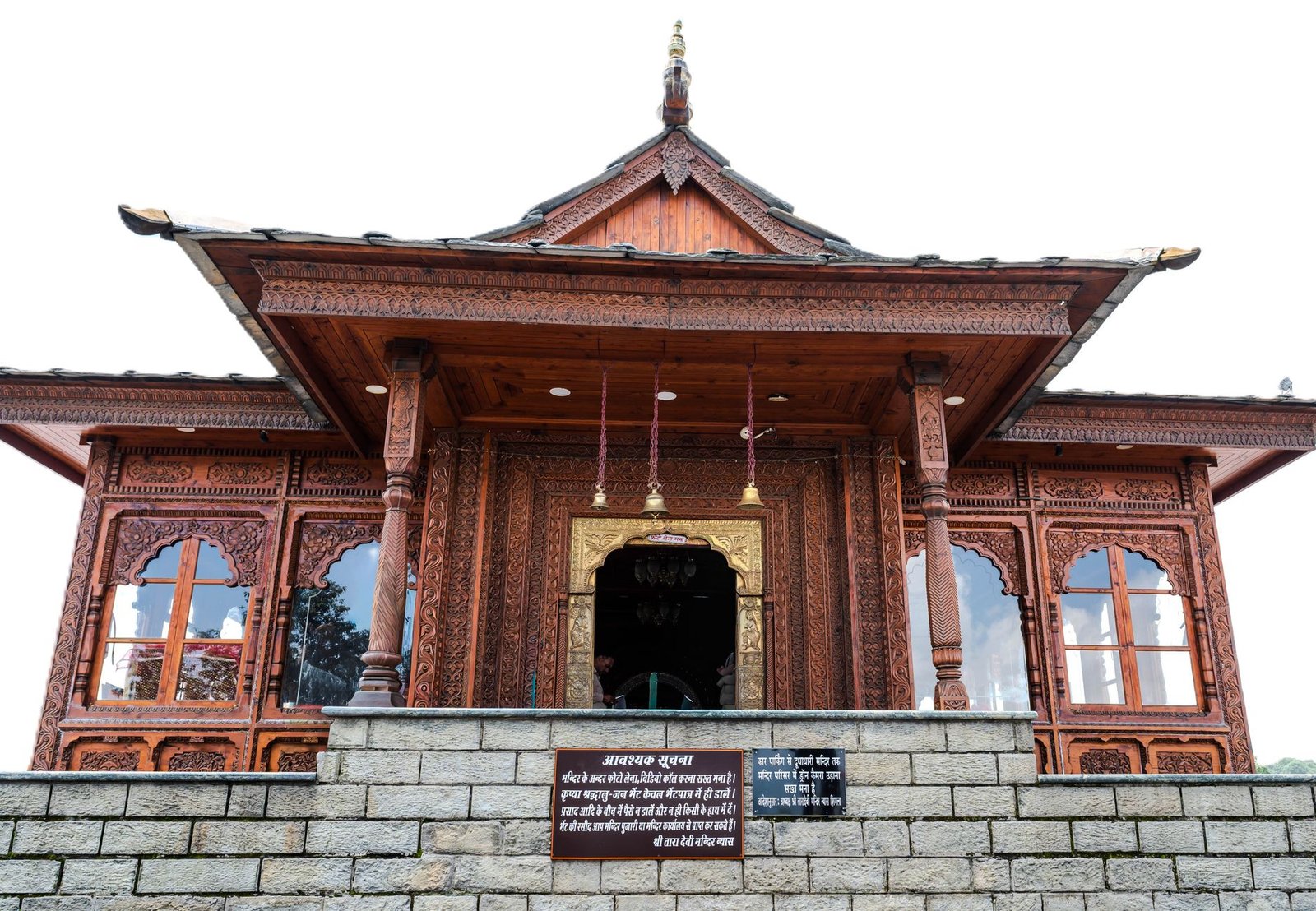 Beautifully carved wooden temple facade in Shimla, Himachal Pradesh, India.