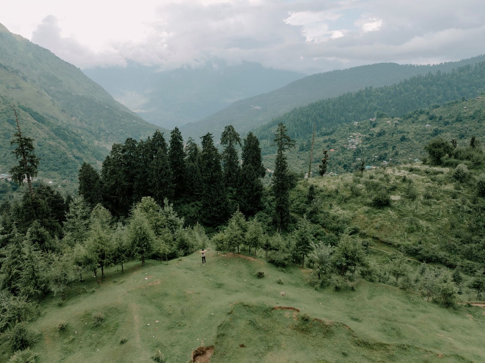 Explore the tranquil beauty of a verdant mountain landscape, perfect for nature and adventure enthusiasts.