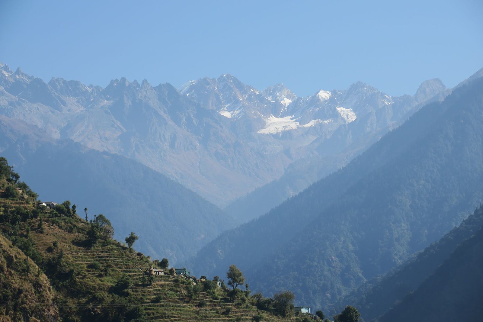 A breathtaking view of the majestic Himalayan mountains under a clear blue sky.