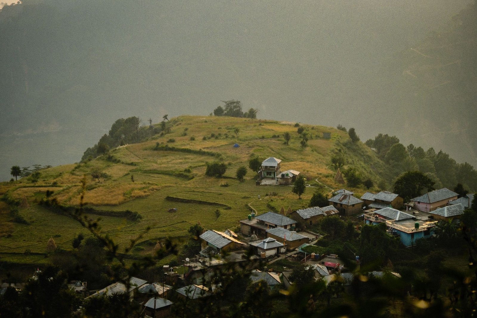 A picturesque view of a serene village in the Himalayas, Dharamshala, Himachal Pradesh.