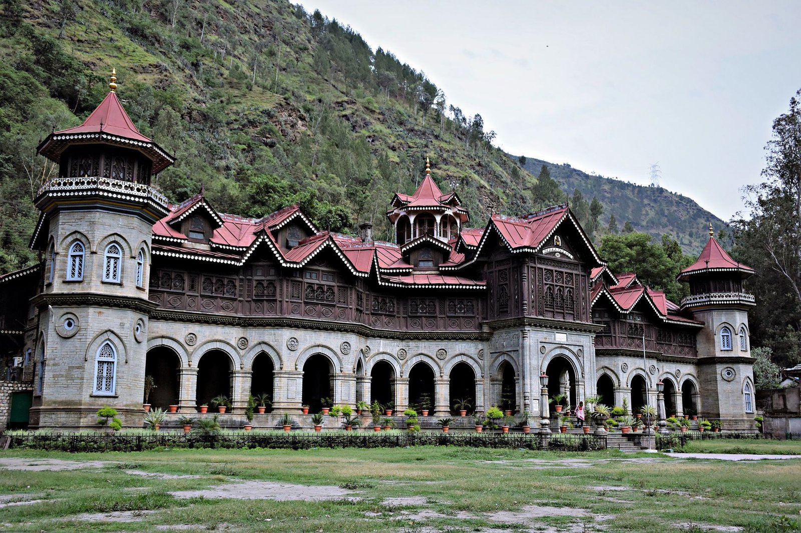Architectural marvel of Padam Palace amidst lush greenery in Himachal Pradesh.